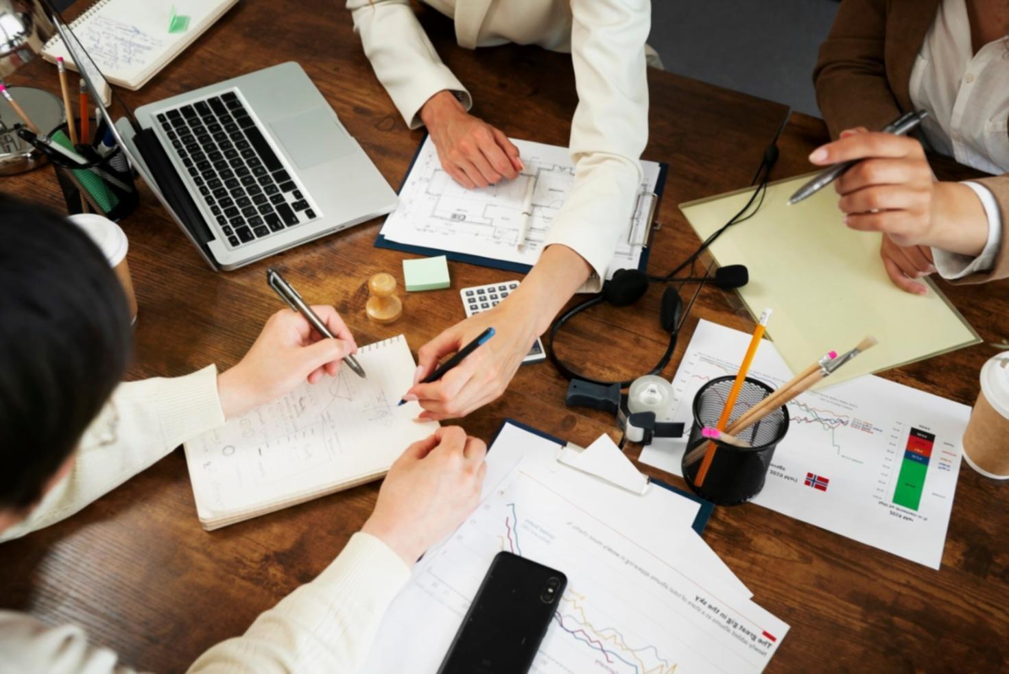 Business team analyzing financial reports in modern office environment